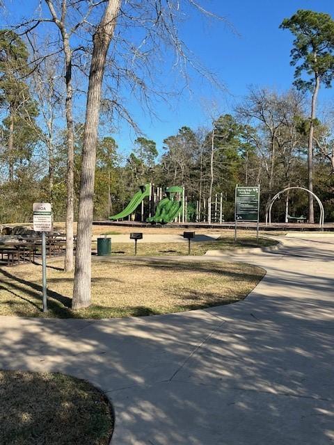 view of home's community featuring playground community