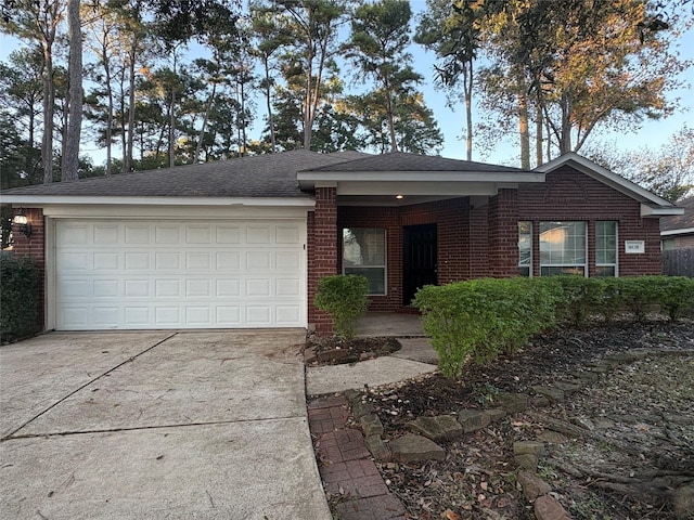 single story home featuring a garage