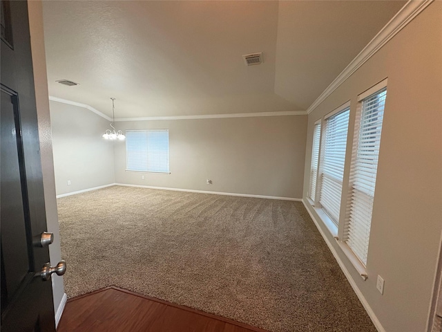 unfurnished room with carpet flooring, crown molding, a chandelier, and vaulted ceiling