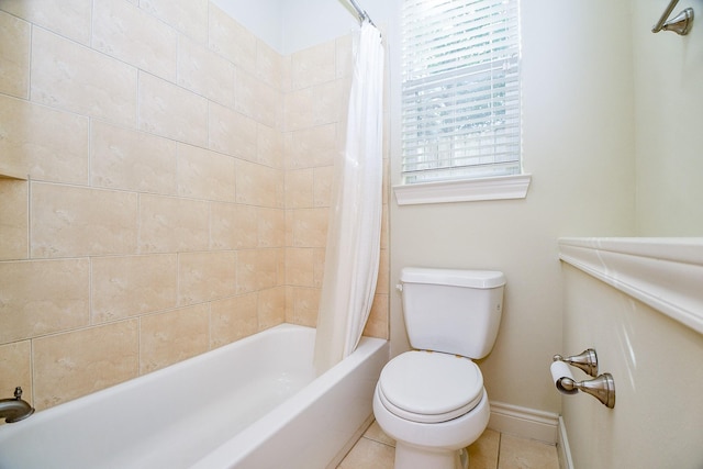 bathroom featuring tile patterned floors, shower / bath combination with curtain, and toilet