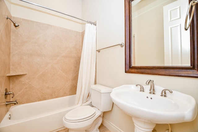 full bathroom with shower / bath combo, toilet, and sink