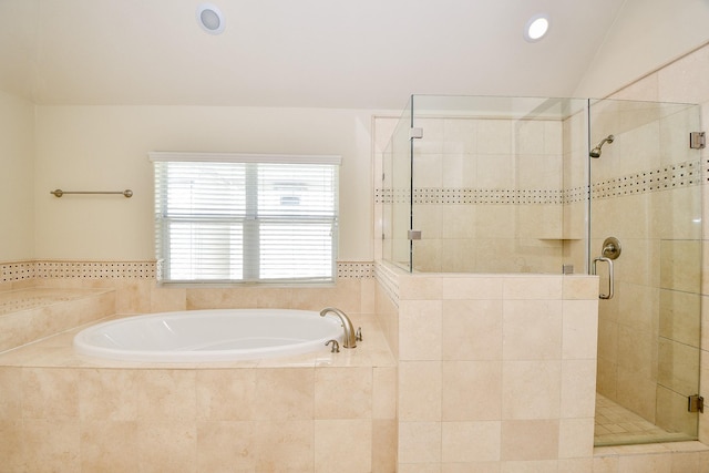 bathroom featuring separate shower and tub and vaulted ceiling