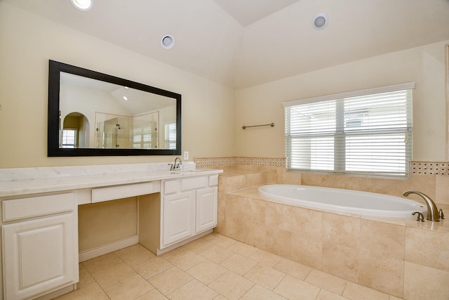 bathroom featuring tile patterned floors, vanity, shower with separate bathtub, and vaulted ceiling