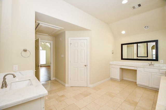 bathroom featuring vanity, tile patterned floors, and lofted ceiling