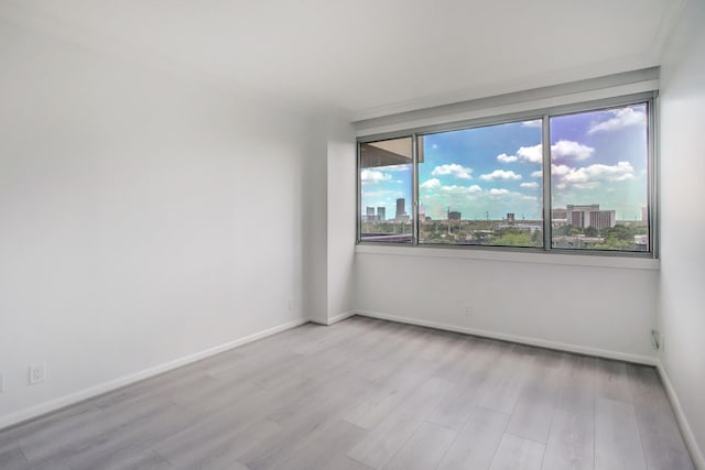 spare room with light wood-type flooring