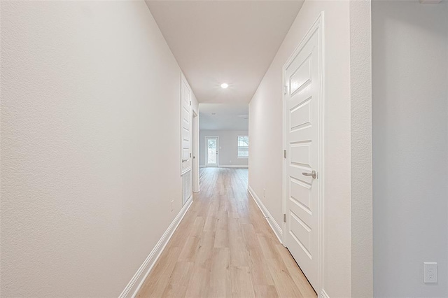 corridor featuring light wood-type flooring