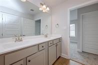 bathroom featuring vanity and an inviting chandelier