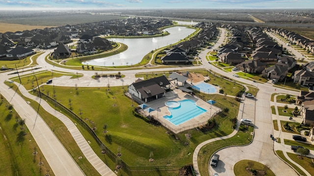 drone / aerial view with a water view