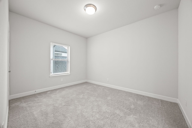5707 Dancing Oaks Ct, Manvel, TX 77578 - carpeted empty room with baseboards