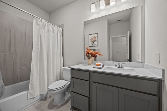 full bathroom featuring vanity, toilet, and shower / tub combo