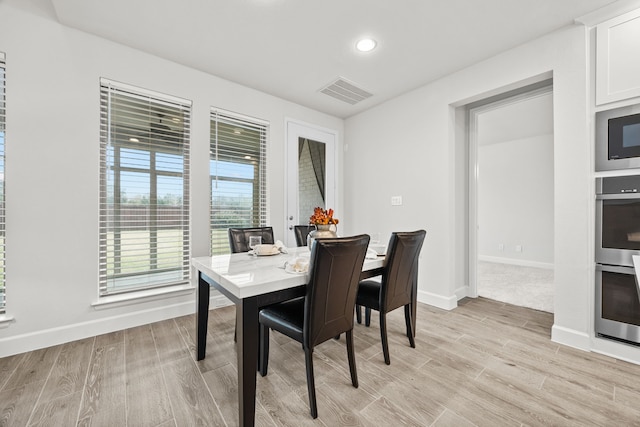 dining area with light wood-type flooring