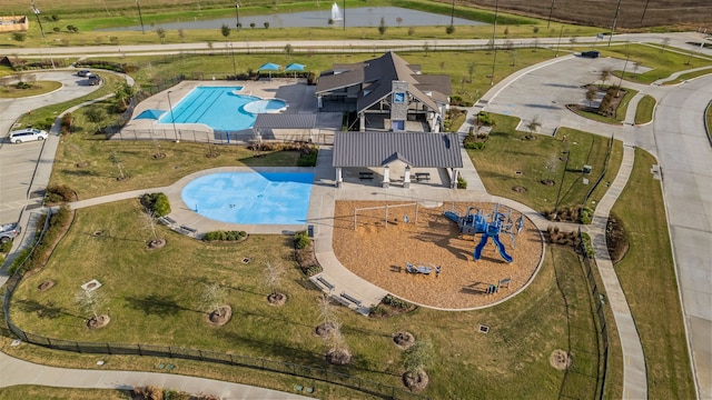 birds eye view of property featuring a water view