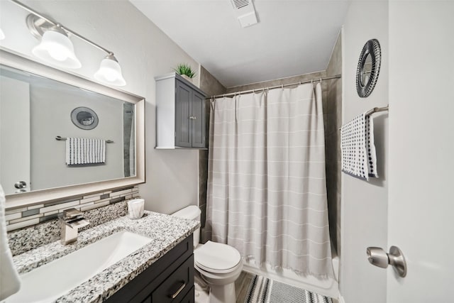 full bathroom featuring decorative backsplash, toilet, vanity, and shower / tub combo with curtain