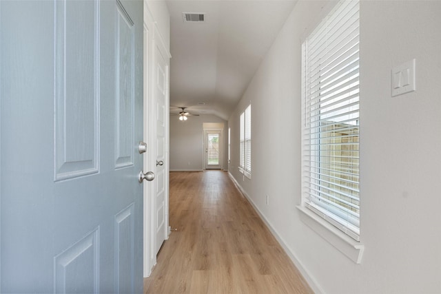 2971 Colonia Blossom Ln, Pinehurst, TX 77362 - hallway featuring light wood-style floors, baseboards, and lofted ceiling
