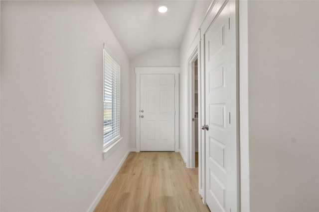 2971 Colonia Blossom Ln, Pinehurst, TX 77362 - corridor featuring light wood-style floors, lofted ceiling, and baseboards