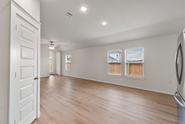 2971 Colonia Blossom Ln, Pinehurst, TX 77362 - unfurnished living room featuring light wood-style floors, a ceiling fan, recessed lighting, and baseboards