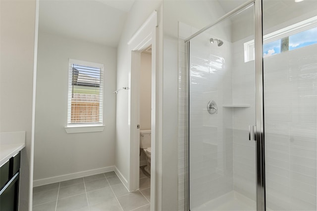 2971 Colonia Blossom Ln, Pinehurst, TX 77362 - full bathroom featuring toilet, tile patterned floors, a stall shower, and baseboards