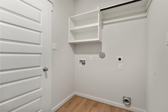 2971 Colonia Blossom Ln, Pinehurst, TX 77362 - laundry room featuring electric dryer hookup, baseboards, light wood finished floors, washer hookup, and gas dryer hookup