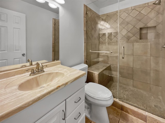 bathroom featuring walk in shower, vanity, and toilet