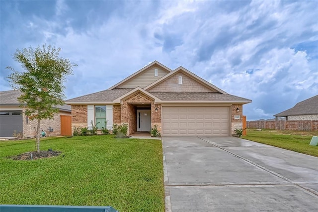 view of front of home with a front lawn and a garage