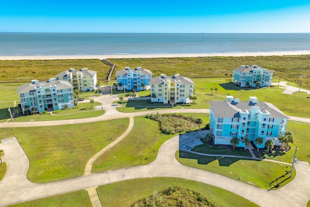 bird's eye view featuring a view of the beach and a water view