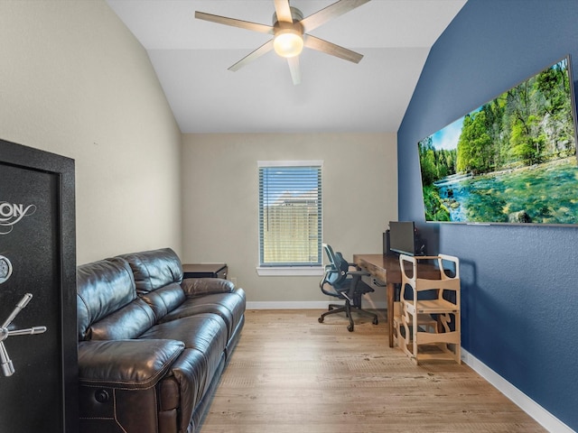 office area with ceiling fan, light hardwood / wood-style floors, and vaulted ceiling