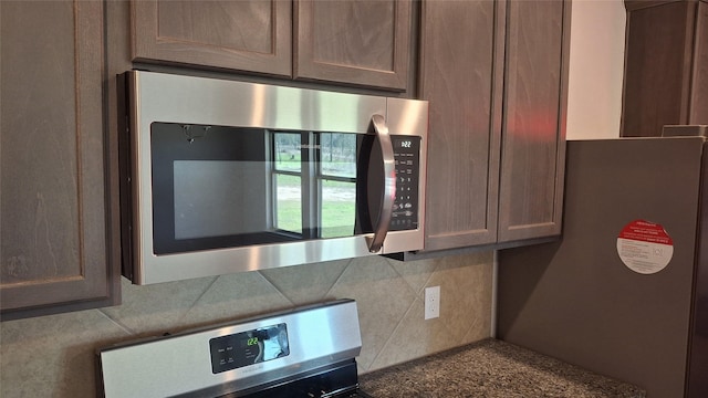 interior details with tasteful backsplash and appliances with stainless steel finishes