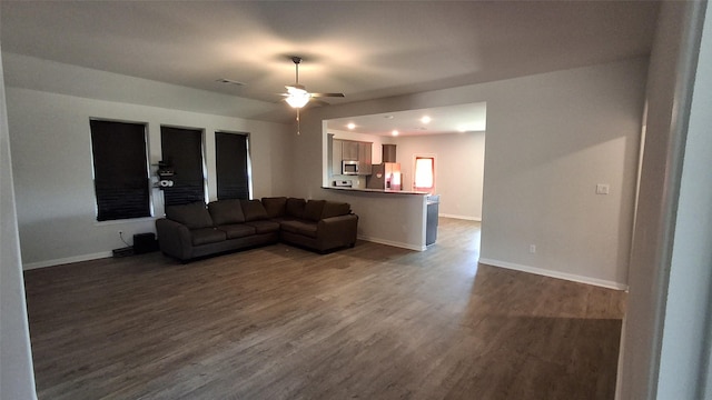 living room with hardwood / wood-style floors and ceiling fan