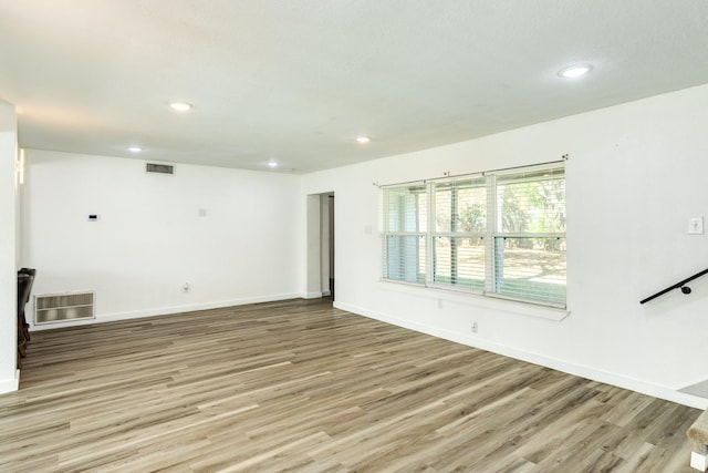 spare room featuring light wood-type flooring