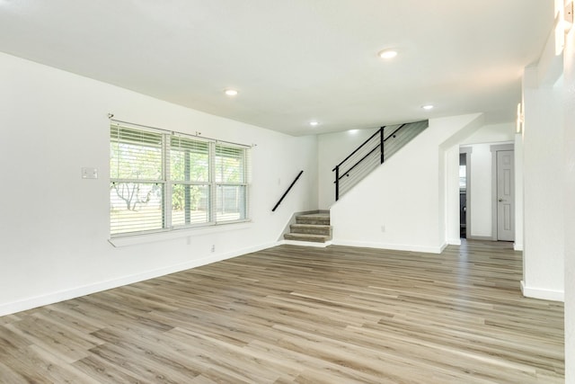 unfurnished living room featuring light wood-type flooring