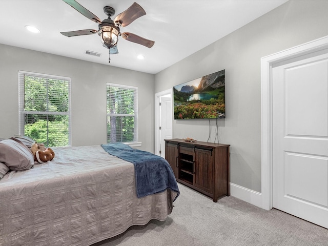 carpeted bedroom featuring ceiling fan