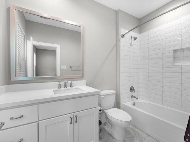 full bathroom with vanity, toilet, and tiled shower / bath combo