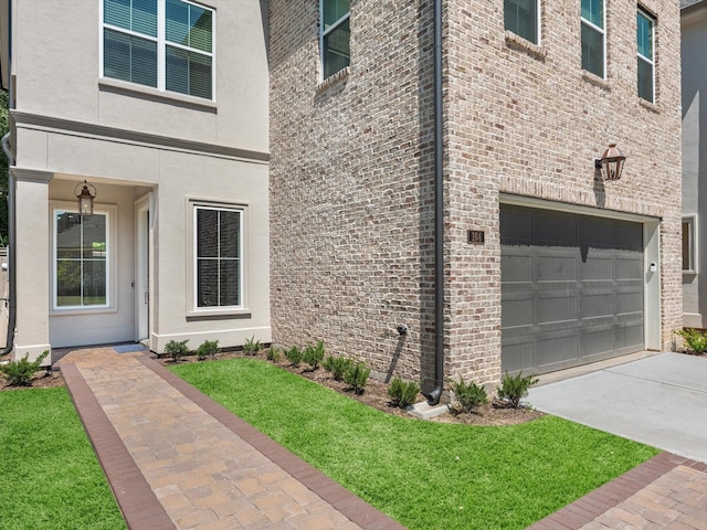 doorway to property with a garage