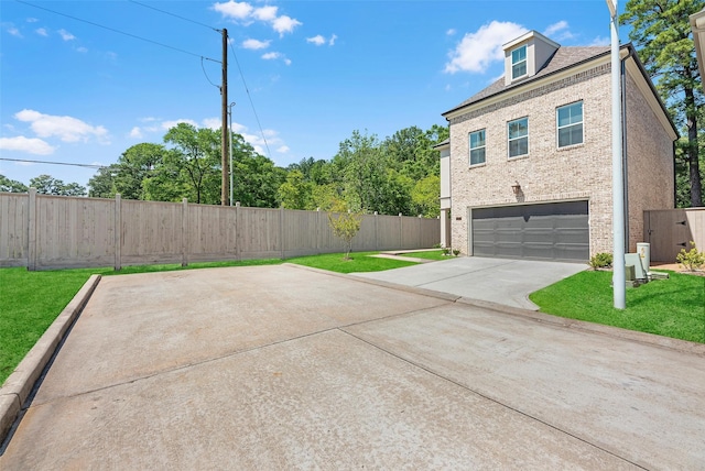 view of property exterior with a lawn and a garage