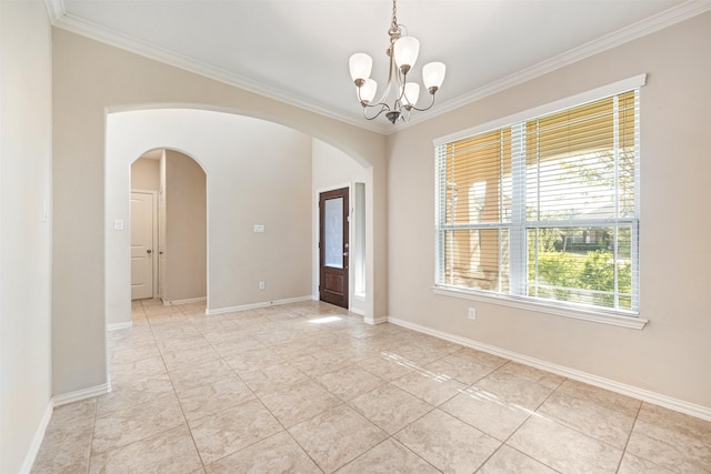 tiled empty room featuring ornamental molding and an inviting chandelier