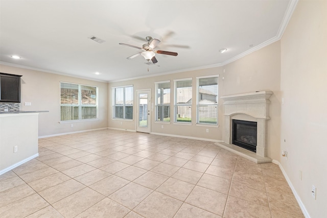 unfurnished living room featuring ceiling fan, crown molding, and light tile patterned flooring