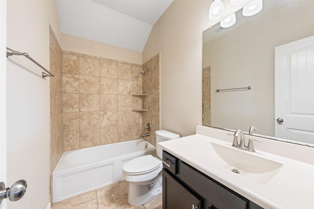 full bathroom with vanity, lofted ceiling, tile patterned floors, tiled shower / bath, and toilet