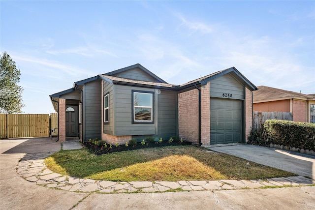 ranch-style home with a garage and a front lawn