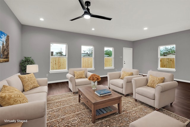 living room with ceiling fan and hardwood / wood-style floors