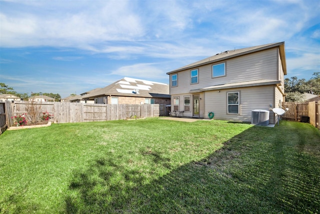 back of property with a lawn, a patio area, and cooling unit