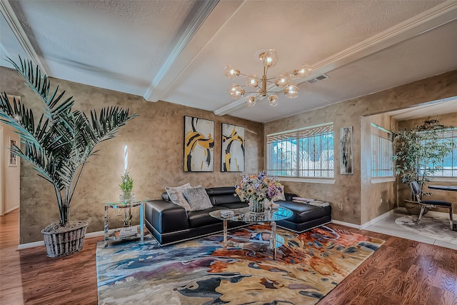 living room featuring beamed ceiling, a textured ceiling, hardwood / wood-style flooring, and a notable chandelier