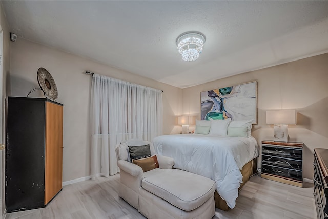 bedroom with light wood-type flooring