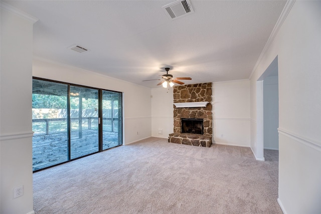 unfurnished living room with ceiling fan, crown molding, and a fireplace