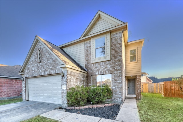 view of front of home featuring a garage and a front lawn