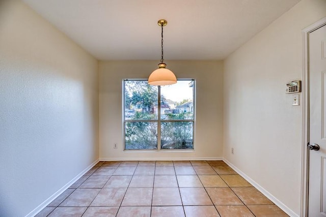 unfurnished dining area with light tile patterned floors