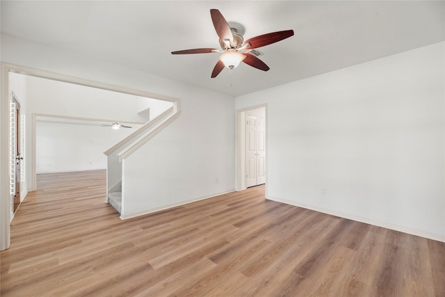 unfurnished living room featuring light wood-type flooring and ceiling fan