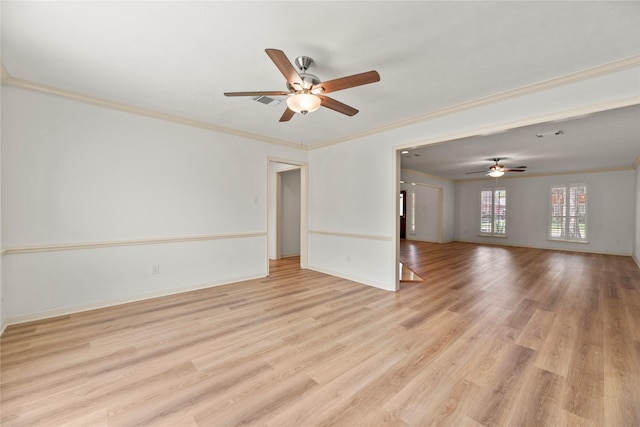 spare room featuring ceiling fan, ornamental molding, and light hardwood / wood-style flooring