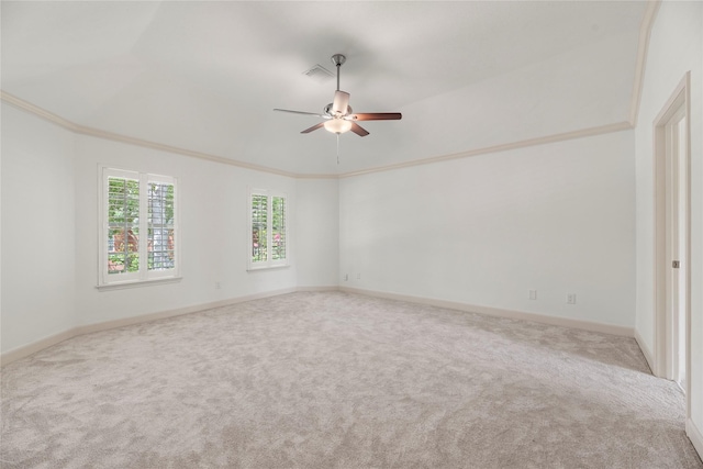 unfurnished room with light carpet, ceiling fan, and ornamental molding