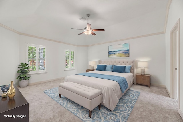 bedroom with ceiling fan, crown molding, and light carpet