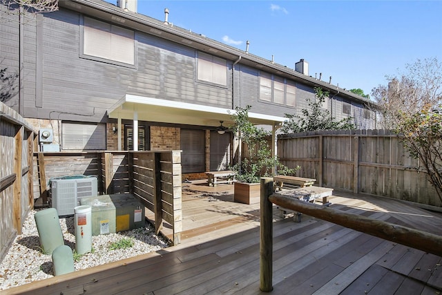 wooden deck with central air condition unit